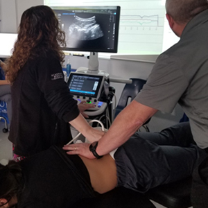 picture West Des Moines chiropractic ultrasound imaging of spinal vertebrae during treatment